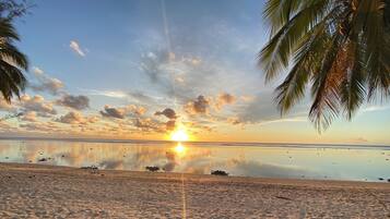 On the beach, sun loungers, beach towels