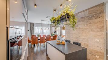 Deluxe Villa | Private kitchen | Full-size fridge, microwave, oven, stovetop