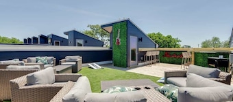 Spring rooftop deck, game room, skyline views near Broadway