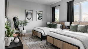 A modern hotel room with two beds, a large mirror, and artwork on the walls. - Casa Paradisa • Rooftop, Fire Pit, Skyline Views (Nashville)