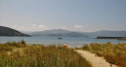 Country house with gate next to the sea