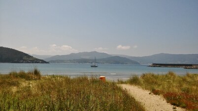 Country house with gate next to the sea