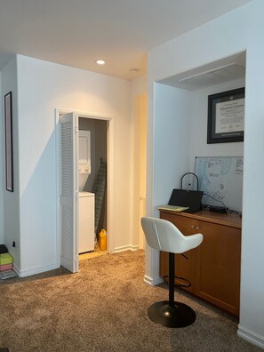Productive workspace with a desk, chair, and cabinet, perfect for staying focused.