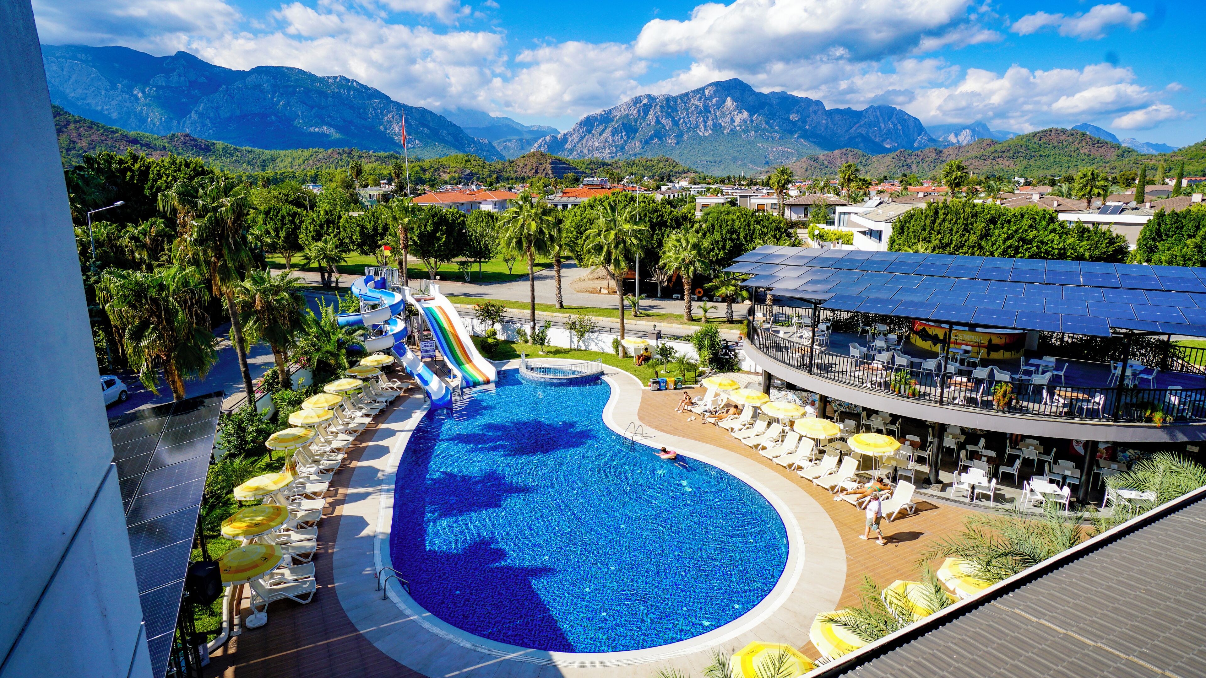 Seasonal outdoor pool, open 7:00 AM to 7:00 PM, pool umbrellas