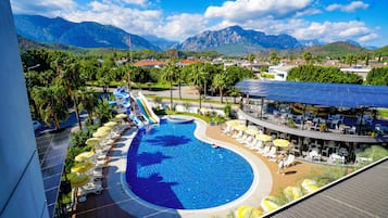 Seasonal outdoor pool, open 7:00 AM to 7:00 PM, pool umbrellas