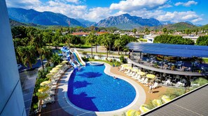 Seasonal outdoor pool, open 7:00 AM to 7:00 PM, pool umbrellas