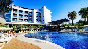 Seasonal outdoor pool, open 7:00 AM to 7:00 PM, pool umbrellas