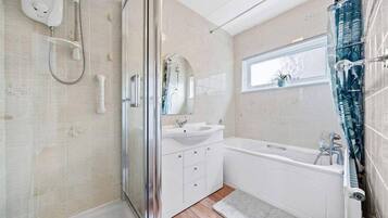 Bathtub, hair dryer, towels