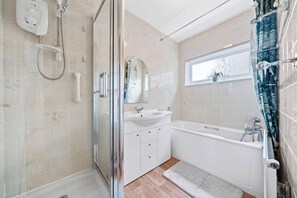 Bathtub, hair dryer, towels