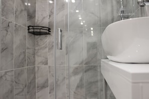 Shower, hair dryer, towels, soap