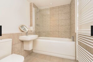 Combined shower/tub, hair dryer, towels, soap