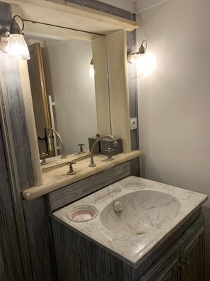 Bathtub, hair dryer, towels, soap