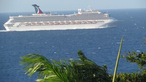 A large cruise ship with multiple decks and lifeboats visible. - Fun for the entire family.  Explore the island from a down home point of view. (Montego Bay)