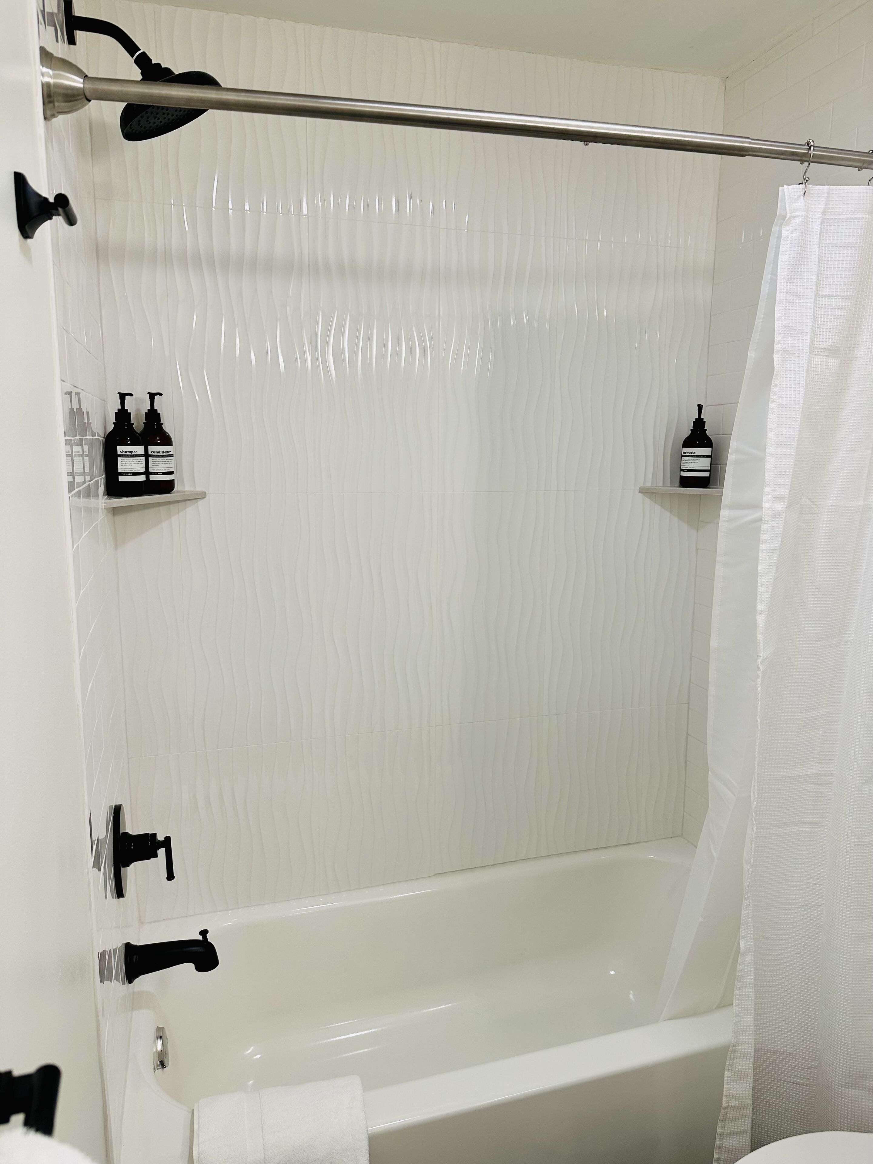 Combined shower/tub, hair dryer, towels, soap