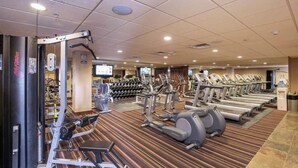 A gym with treadmills, elliptical machines, and weight machines. - SKI-IN/OUT Charming studio condo steps to lift in the heart of Purgatory Resort! (Durango)