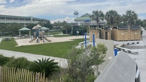 A playground with slides and swings, a water tower, and a building with a green roof. - Private home in Mt. Pleasant, SC Vacation Rental 10 min drive to the beach. (Mount Pleasant)