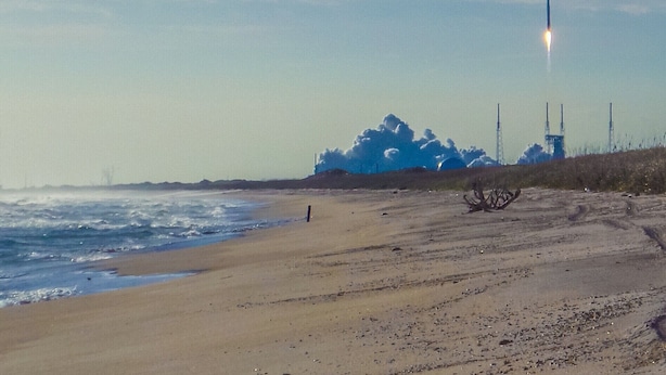 A beach with a rocket launch in the background. - Hello Sunshine 321.. Lift Off (Titusville)