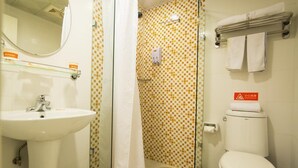 A bathroom with a white sink, a toilet, and a shower area. - Home Inn Hotel Beijing Tongzhou Xinhua South Road (Tongzhou)