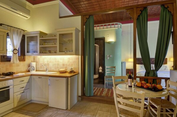 Fridge, coffee/tea maker, toaster, cookware/dishes/utensils