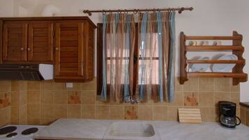 Fridge, coffee/tea maker, toaster, cookware/dishes/utensils