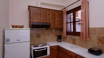 Fridge, coffee/tea maker, toaster, cookware/dishes/utensils