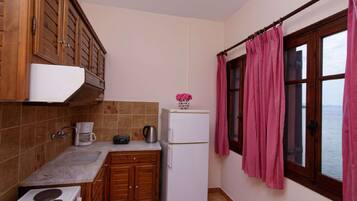 Fridge, coffee/tea maker, toaster, cookware/dishes/utensils