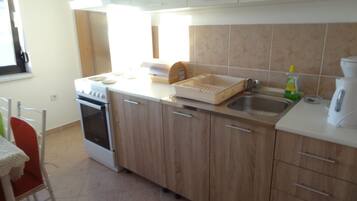 Apartment, 2 Bedrooms, Smoking, Balcony | Private kitchen | Fridge, electric kettle, cookware/dishes/utensils, dining tables