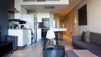 Apartment, 1 Bedroom, Balcony, City View | Living area | TV