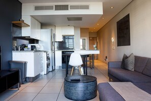 Apartment, 1 Bedroom, Balcony, City View | Living area | TV