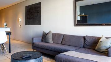 Apartment, 1 Bedroom, Balcony, City View | Living area | TV
