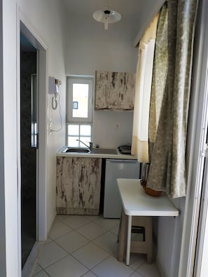 Studio, 1 Bedroom, Balcony, Pool View | Living area | TV, books - A Studio With Balcony (Malevizi)