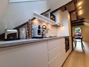 Apartment, 2 Bedrooms, Balcony, Garden View | Private kitchen | Coffee/tea maker