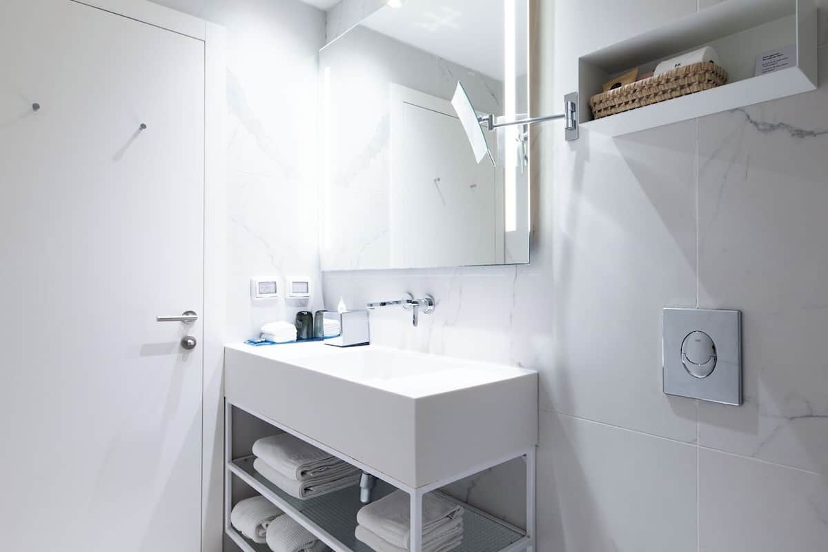 superior twin room | bathroom | designer toiletries, hair dryer, bathrobes, slippers