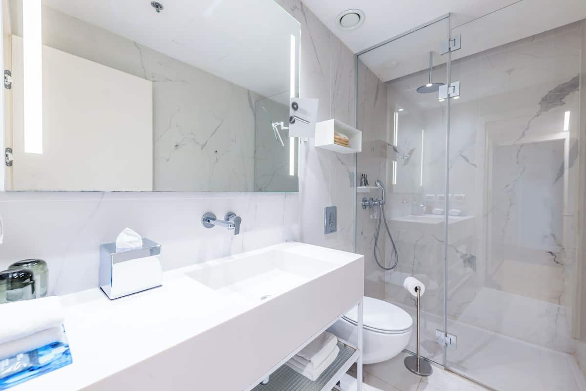 superior twin room | bathroom | designer toiletries, hair dryer, bathrobes, slippers