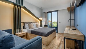 A modern bedroom with a bed, bedside tables, a desk, and a balcony. - Pidna (Dio-Olympos)