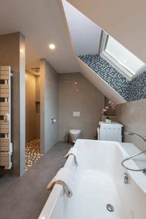 Bathtub, hair dryer, towels