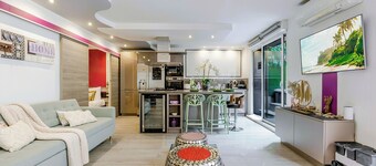 Jacuzzi privé, sauna, borne d'arcade, terrasse, AC, Gite le 14