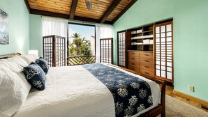 A bedroom with a bed, wooden ceiling, and a view through a sliding door. - KKSR#7303 Remodeled Top Floor Unit With Loft, Golf Course Views (Kailua Kona)