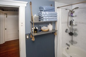 Bathtub, hair dryer, towels, soap