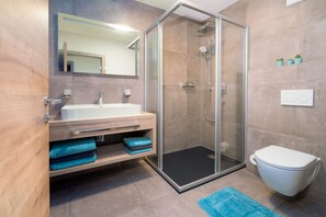Shower, hair dryer, towels, soap