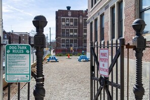 A dog park with rules and a private property sign. - Sosuite | 2BR Loft w W/D, Gym, Lounge (Philadelphia)