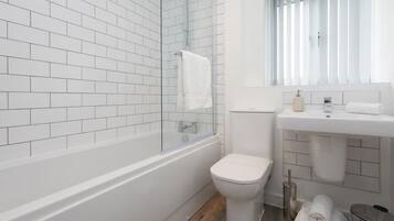 Shower, hair dryer, towels, shampoo