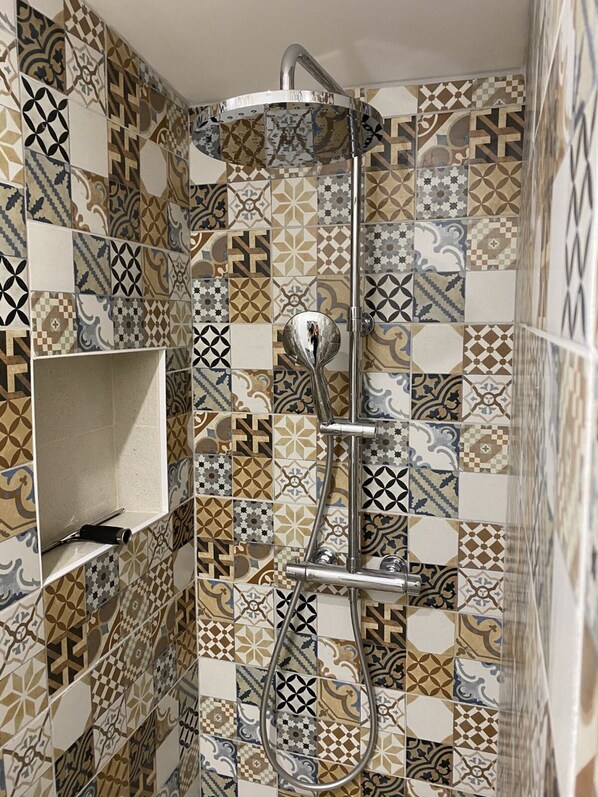 Shower, towels, soap, toilet paper