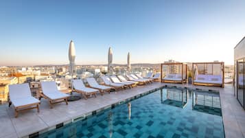 Outdoor pool, open 9:00 AM to 8:00 PM, pool umbrellas, pool loungers