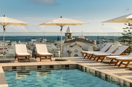Outdoor pool, open 9:00 AM to 8:00 PM, pool umbrellas, sun loungers