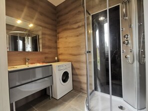 Shower, towels, soap, toilet paper