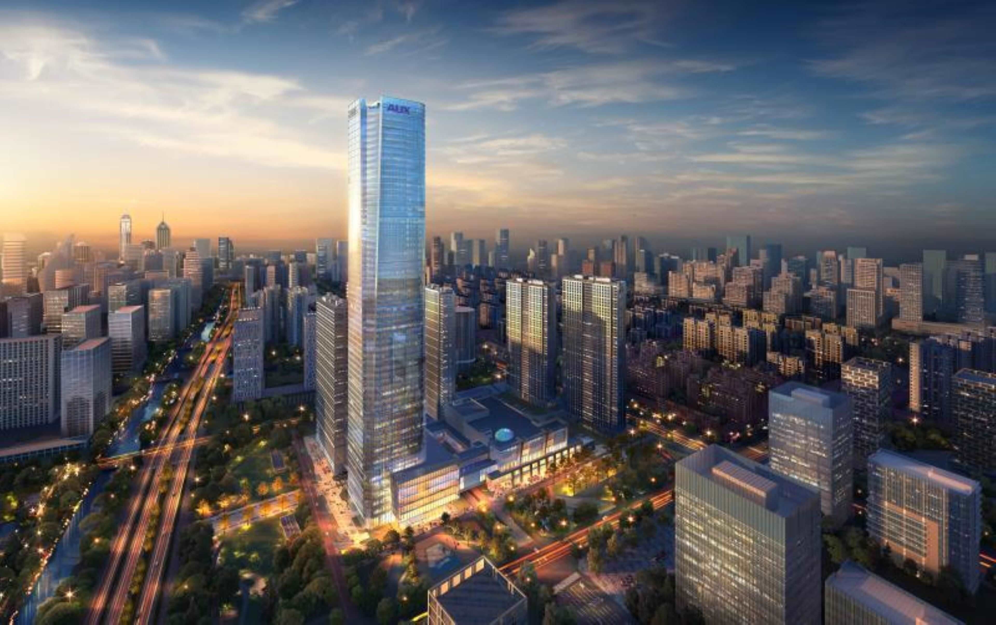 A high-rise building with a modern glass facade, surrounded by a dense urban skyline with various other high-rise buildings.
