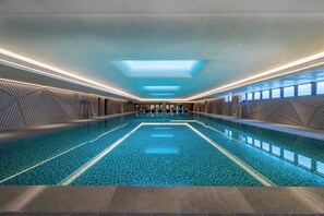 Indoor pool, open 7:00 PM to 10:30 PM, pool loungers, lifeguards on site