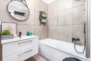 Bathtub, hair dryer, towels