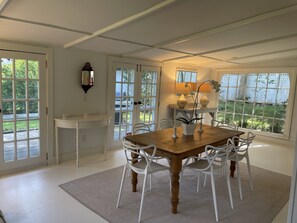 Enjoy meals in this cozy dining area with a view of the backyard.